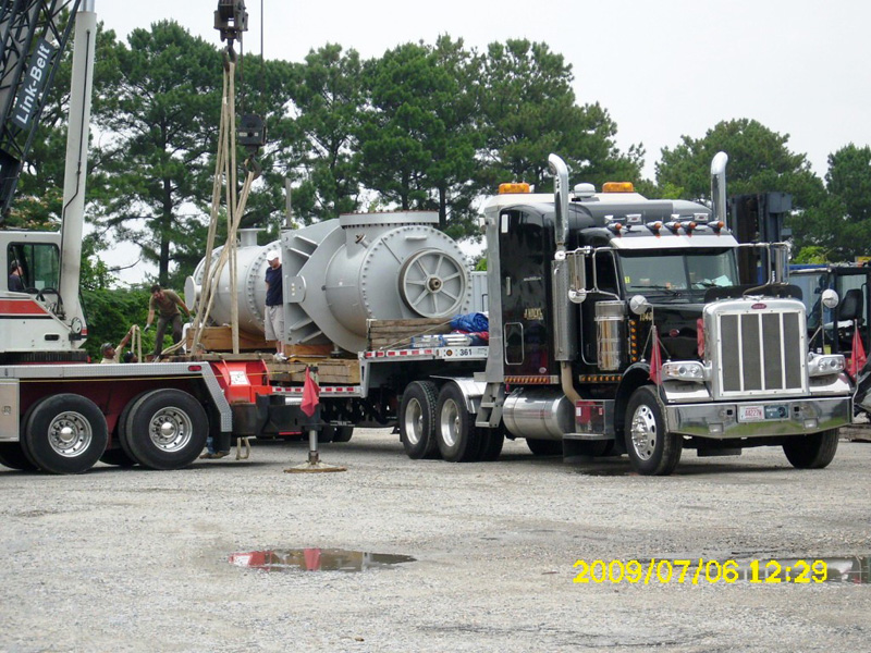 Truck carrying over-weight, large vault, shipping item
